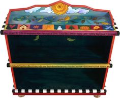 an artisticly painted wooden box with writing on the front and sides, decorated with colorful images