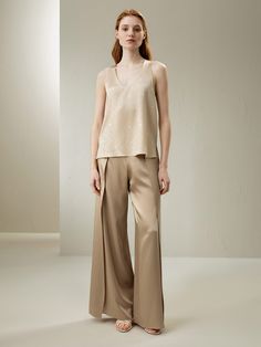 The Silk Charmeuse Wide-Leg Pant is crafted from luxurious water shine silk fabric. This has made it wonderfully soft and smooth to the touch, with a delicate matte finish, plus lightweight and breathable for year-round wear. With the overlapping panels that reveal skin when walking, it provides a more versatile look compared with normal wide-leg pants. No matter the kind of occasion you are going, these pants will be your betrusted option. Luxury Viscose Wide Leg Pants With Relaxed Fit, Elegant Luxury Wide Leg Viscose Pants, Luxury Elegant Wide Leg Viscose Pants, Luxury Silk Wide Leg Pants Elegant Style, Luxury Wide Leg Viscose Bottoms, Luxury Silk Bottoms For Daywear, Luxury Silk Ankle Pants, Luxury Silk Full Length Bottoms, Luxury Silk Trousers Pantsuit