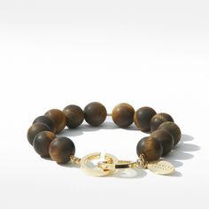 PRODUCT DETAILS Classic Matte Tiger's Eye beads, 10mm 18-karat heavy gold plated snake chain or sterling silver snake chain Interlocking 18-karat heavy gold plated clasp or silver plated clasp Tiger Gold Bracelet For Men, Red Tiger Eye Bracelet, Tiger Bracelet Gold, Tigers Eye Crystal Bracelet, Luxury Gold-tone Brass Bracelet, Tiger Eye Bracelet, Silver Snake Chain, Tiger Eye Beads, Eye Beads