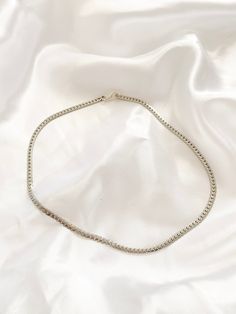 Simple Silver Flat Snake Chain. Great for layering up. Made of Non rust Stainless Steel Ensure to measure neck with measuring tape in inches. (You may want to leave a little extra room so your necklace is not too tight) Please select your length you would like you choker to be at checkout. Made from Stainless Steel, lead free, nicked free. Silver Choker Chain Necklace For Everyday, Everyday Silver Chain Choker Necklace, Everyday Silver Choker Chain Necklace, Everyday Silver Clavicle Chain Choker, Minimalist Snake Chain Choker, Silver Snake Chain Choker, Silver Adjustable Curb Chain Necklace, Adjustable Silver Curb Chain Necklace, Curb Chain Choker Necklace For Gifts