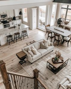 an overhead view of a living room and kitchen area in a home with hardwood floors