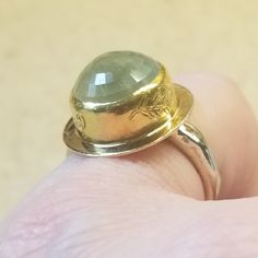 This Is An Authentic Women's Jes Maharry Band Ring. Very Rare Ring And The Only One On Ebay. It Was Purchased From Sundance. Jes Maharry Is A Classic Designer And This Ring Is Timeless Ring. Very Heavy Ring. It Measures 8.2 Grams. Ring Is Stamped Inside With, "Jes" And 14k. This Is A Genuine Faceted Cabochon Peridot. The Stone Is 5 Carats. The Ring Says, "Grow Strong" And Has A Leaf Design. Size 4 1/2. Yellow Gold Round Design Around The Faceted Cabochon And The Band Is Done In White Gold. This Unique Yellow Gold Moonstone Ring For Anniversary, Unique Faceted Yellow Gold Ring, Faceted Moonstone Ring In Yellow Gold For Anniversary, Luxury Yellow Gold Rings With Green Amethyst, Gold Rings With Green Amethyst For Formal Events, Yellow Gold Domed Sapphire Ring, Gold Rings With Green Amethyst For Formal Occasions, Formal Gold Rings With Green Amethyst, Faceted Yellow Gold Moonstone Anniversary Ring