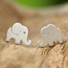 Thai artisan Jantana designs and crafts these endearing elephant earrings. The elephants are drawn on a sheet of sterling silver then hand-cut into the correct shape and detailed with Jantana's signature brushed-satin finish. Elephant Earrings Studs, Cute Stud Earrings, Elephant Jewelry, Contemporary Jewelry Design, Elephant Earrings, Silver Elephants, Silver Button, Jewelry Workshop, Recycled Jewelry