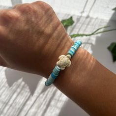 A mix of different color blues with a tan turtle charm! Very beachy and cute Bohemian Light Blue Bracelet For Beach, Casual Blue Jewelry, Blue Friendship Bracelets For Vacation, Blue Beachy Friendship Bracelet, Casual Beaded Bracelets For Vacation, Blue Strand Jewelry For Friendship, Casual Blue Jewelry For Vacation, Bohemian Light Blue Friendship Bracelets For Beach, Casual Turquoise Jewelry For The Beach