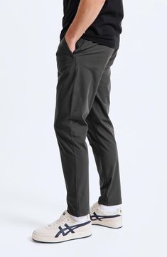 These versatile slim-leg trousers from the label's Coach's series are made from stretch fabric for comfort in the office or on the back nine. 31" inseam; 13" leg opening; 10 3/4" front rise Zip fly with snap closure Front zip pockets; back welt pockets Diamond crotch gusset for added mobility and stretch 52% polyester, 48% recycled polyester Machine wash, line dry Imported Stretch Solid Work Pants For Business Casual, Stretch Solid Color Work Pants For Business Casual, Stretch Business Casual Dress Pants With Elastic Waistband, Stretch Dress Pants With Elastic Waistband For Business Casual, Versatile 4-way Stretch Dress Pants For Business Casual, Stretch Ankle-length Business Pants, Stretch Ankle-length Pants For Business, Casual Office Dress Pants With 4-way Stretch, Comfort Stretch Straight Leg Dress Pants For Business Casual