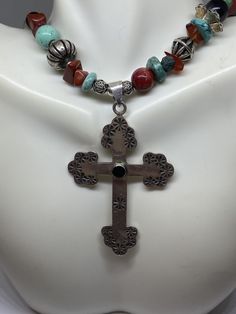 "This piece is so beautiful. It is a genuine, vintage, Taxco multi stone and sterling silver cross necklace. The necklace is 22 inches. The necklace features gorgeous, natural blue turquoise, red coral, carnelian, black onyx and sterling silver beads with a huge stamped sterling silver and black onyx cross. The stones are nuggets, round beads, rondelle beads. The sterling silver beads are stunning with etchings, including flowers, scrollwork, ribbed and other designs; some beads are shaped like Spiritual Cross Turquoise Necklace For Gift, Spiritual Turquoise Cross Necklace As Gift, Spiritual Turquoise Cross Necklace For Gift, Spiritual Turquoise Cross Necklace, Southwestern Silver Cross Pendant Necklace, Southwestern Style Silver Cross Pendant Necklace, Southwestern Style Silver Cross Necklace, Southwestern Style Silver Cross Necklaces, Handmade Turquoise Cross Necklace Spiritual