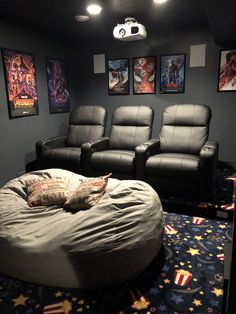 a large bean bag chair sitting in front of two recliners