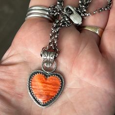 Orange Spiny Oyster Heart Pendant with Thick Rolo Chain – Sangria Silver Designs Sterling Silver Orange Cabochon Jewelry, Orange Cabochon Sterling Silver Jewelry, Orange Sterling Silver Round Pendant Jewelry, Unique Orange Sterling Silver Necklace, Orange Large Pendant Jewelry, Unique Orange Sterling Silver Jewelry, Collectible Orange Sterling Silver Jewelry, Handmade Heart-shaped Orange Jewelry, Handmade Orange Heart Jewelry