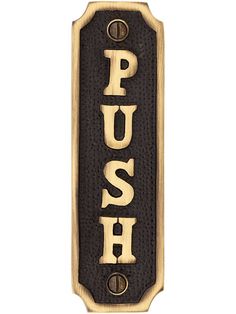 a sign that says push on it with the word push written in gold and black