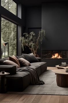 a living room with a couch, coffee table and fire place in the middle of it