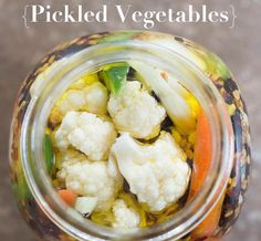 a jar filled with lots of different types of vegetables