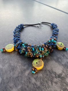 Unique, Hand knitted, Hand Made, Japanese & Chinese Seed Beads, Leather, Ceramic dangles Unique Handwoven Multicolor Beaded Necklaces, Artisan Yellow Beaded Necklaces Handwoven, Unique Adjustable Handwoven Necklace, Unique Handwoven Blue Beaded Necklace, Artisan Multicolor Hand-strung Necklaces, Hippie Necklace, Bead Jewelry, Porcelain Ceramics, Seed Bead Jewelry