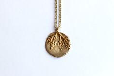 "This necklace is from our Plant Collection. Each piece in this collection is truly one of a kind as they feature a pendant with an imprint from a live plant. ----- Item Details ----- The hand-sculpted Sterling Silver pendant is plated in 18K Gold and measures 1.25\" with a branching fern imprint.  It is on a 28\" inch chain necklace (that is adjustable by +2\"). ----------- We are proud of the fact that any Liza Shtromberg pieces made with silver have been created using 100% recycled silver." Hand Cast Nature-inspired Sterling Silver Jewelry, Gold Medallion Hand Cast Jewelry, Gold Medallion Jewelry Hand Cast, Handmade Gold Nature-inspired Necklace, Nature-inspired Pendant Necklace With Etched Details, Hand Cast Pendant Jewelry For Anniversary, Nature-inspired Recycled Gold Jewelry For Gifts, Nature-inspired Engraved Jewelry For Jewelry Making, Handmade Nature-inspired Gold Necklace