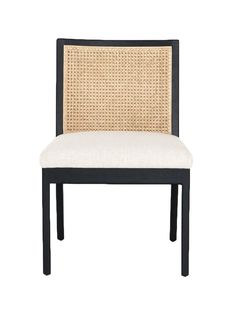 a black and white chair with wicker back