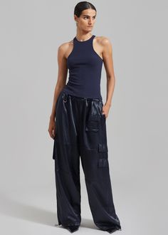 Color: Navy Cotton blend rib knit with stretch Fitted silhouette Racerback Sleeveless tank Unlined 98.5% Cotton 1.5% Elastane Machine Wash Cold By The Frankie Shop. Imported Satin Cargo Pants, Rib Tank Top, The Frankie Shop, Tank Top Outfits, Frankie Shop, Paris Woman, Ribbed Tank Tops, Sleeveless Tank, Satin Fabric