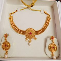 Title: "Timeless Splendor: Temple Gold Plated Jewelry Set" Step into the realm of timeless elegance with our Temple Gold Plated Jewelry Set, a majestic ensemble that encapsulates the essence of South Indian heritage. Crafted with meticulous attention to detail, this set is more than just jewelry; it's a symbol of tradition and grace, making it an ideal gift for any cherished occasion. Indulge in the opulence of our gold-plated necklace, intricately adorned with traditional South Indian motifs an Temple Jewelry Style Gold Plated Choker, Gold Plated Temple Jewelry Choker As Gift, Antique Round Necklace For Festivals, Gold Plated Necklaces For Anniversary And Festivals, Gold Temple Jewelry Pearl Necklace For Anniversary, Gold Temple Jewelry Style Pearl Necklace For Anniversary, Antique Round Necklaces For Festivals, Traditional Round Necklaces For Anniversary, Yellow Gold Costume Jewelry Necklace For Wedding