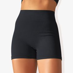 The Anna-Kaci Women's Wide Band Stretchy Rib Knit Seamless Gathered Biker Shorts are a must-have for your activewear collection. These shorts feature a wide band that offers a secure and comfortable fit, enhancing your silhouette with shaping seams. Made from stretchy rib knit fabric, they provide excellent flexibility and movement while maintaining a seamless construction for a smooth, irritation-free experience. The gathered detail adds a touch of style, making these biker shorts perfect for w Black Seamless Activewear With Built-in Shorts, Seamless High Waist Biker Shorts, High Waist Solid Seamless Biker Shorts, Elastic Seamless Solid Color Biker Shorts, Elastic Seamless Biker Shorts, Seamless Elastic Biker Shorts, Seamless Yoga Bottoms, Black Breathable Bottoms With No Elasticity, Seamless Construction Fitted Shorts