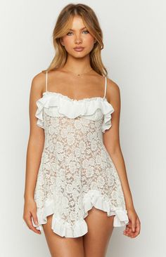 White Lace Mini Dress

How to style:
Slip in to our stunning 'Bodhi' white lace mini dress ()! This feminine piece is perfect for your next festival () event! Style with boots () and gold accessorises to complete the look! 

Features:


  
 * Stretch lace 
 * Mini length 
 * Lined at bust 
 * Light-weight fabrication 
 * Lots of stretch 
 * Unlined body 
 * Ruffles around bust and bottom hem 
 * Spaghetti straps 
 * Adjustable straps 
 * Pull on style White Lace Mini Dress, Prom Midi Dress, White Slip Dress, Eve Dresses, Semi Formal Dresses, Mini Slip, Beginning Boutique, Strapless Tops, Mini Slip Dress