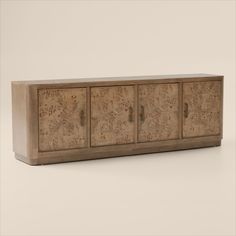 the sideboard is made out of wood and has floral designs on it