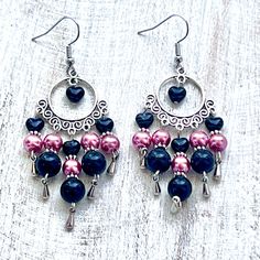 Shop our Black Stone & Pink Glass Pearl Chandelier Earrings for a touch of elegance. Perfect for any occasion, these high-quality earrings feature a unique chandelier design and versatile black and pink colors. Invest in a timeless piece for your jewelry collection today. Black Dangle Chandelier Earrings For Party, Black Chandelier Earrings For Party, Elegant Black Chandelier Earrings With Dangling Beads, Elegant Pink Metal Beaded Earrings, Elegant Pink Beaded Metal Earrings, Black Chandelier Drop Earrings With Ear Wire, Black Chandelier Earrings With Black Beads As Gift, Black Metal Dangle Chandelier Earrings, Elegant Pink Chandelier Earrings With Dangling Beads