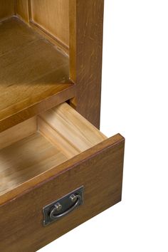 an open wooden drawer with the lid closed