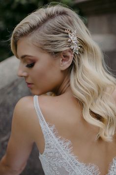 a woman with blonde hair wearing a wedding dress