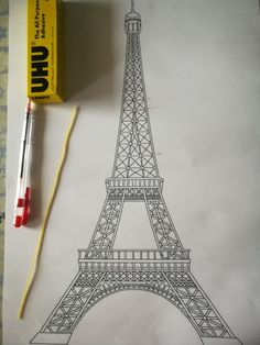 a drawing of the eiffel tower is shown next to a pencil and eraser