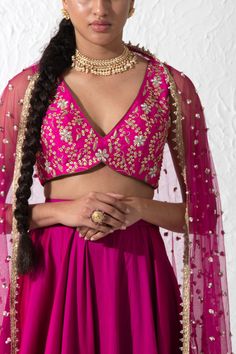 Hot pink lehenga with mirror work, gota patti, zari hand embroidery on the border. Comes with zardozi embroidered V neck blouse and pearl and sequin embroidered dupatta.
Components: 3
Pattern: Embroidered
Type Of Work: Mirror, Gota Patti, Zari, Zardozi and Sequin
Neckline: V neck
Sleeve Type: Sleeveless
Fabric: Taffeta, Raw Silk and Net
Color: Pink
Other Details: 
Sheer dupatta with sequin and pearl embroidery on the border
Blouse with curved hem
Closure:
Blouse: Side zip
Lehenga: Side zip and h Lehenga With Mirror Work, Hot Pink Lehenga, Sheer Dupatta, Pearl Embroidery, Pink Lehenga, Embroidered Lehenga, Embroidered Dupatta, Fashion App, Mirror Work