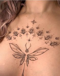 a woman's chest with flowers and butterflies on it