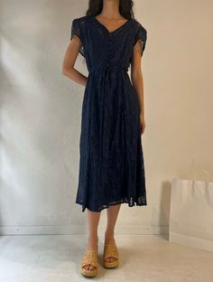 - Vintage Joni Blair navy blue lace dress - Lace shell with lining, 100% nylon - Lacing up the back - Tagged 7/8 Bust: 19" Length: 50" We are not responsible for lost, stolen, or damaged packages once they have been shipped. Any additional customs duties or taxes incurred on international orders are the responsibility of the buyer. Please note that our items are vintage and may have minor flaws or imperfections due to their age, which adds to their unique character. Blue Lace Trim Summer Dress, Blue Scalloped Lace Dress For Summer, Blue Scalloped Lace Summer Dress, Blue Lace Midi Dress With Scalloped Lace, Navy Blue Lace Dress, Blue Lace Dress, Lace Blue Dress, Dress Medium, Dress Lace