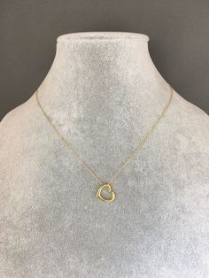 "A sweet and elegant floating 24k gold vermeil heart charm is simply suspended from a fine 14k gold filled chain. The chain measures 16\" with an extension to 18\" and is finished with a gold spring ring clasp. Please send a message if a different length chain is desired. A wonderful gift for a bride, best friend, or anniversary! Floating heart charm: 13x12mm Total length of charm: 1/4\" Gold chain: 1mm This necklace is also available in silver... www.etsy.com/listing/1076790169/silver-heart-nec Open And Close Heart Necklace, Gold Minimalist Heart Necklace With Round Pendant, Delicate Gold Heart Necklace Tarnish Resistant, Yellow Gold Open Heart Necklace Gift For Her, Yellow Gold Heart Necklace With Cable Chain For Anniversary, Elegant Gold Heart Necklace For Everyday, Yellow Gold Open Heart Necklace For Her, Yellow Gold Open Heart Necklace, Yellow Gold Heart Cut Necklace With Delicate Chain