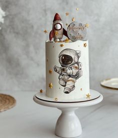 a small cake with an astronaut on it