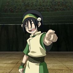 an anime character pointing at the camera with his right hand and wearing a green and white uniform