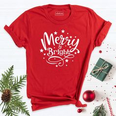 Merry and Bright Shirt, Christmas Shirt, Merry Shirt, Noel Christmas Day T-Shirt, Christmas T-Shirt, Christmas Tee Shirt, Christmas Tshirt. Hi! Welcome to our store. It's good to see you here. Our aim is to offer you first-class clothing in your most beautiful moments with our graphic t-shirts that we designed or designed with your ideas. I am sure you will like our designs for your family, friends and you. IMPORTANT MATTERS FOR ORDERING: 1-) Please check and review all photos. 2-) Our sizes are New Year Holiday Crew Neck T-shirt, Red Holiday Crew Neck T-shirt, Holiday Red Crew Neck T-shirt, Red Graphic Print T-shirt For New Year, Red Crew Neck Holiday T-shirt, Red Crew Neck T-shirt For Holidays, Christmas Letter Print T-shirt Gift, Red Letter Print T-shirt For New Year, Red Letter Print Shirt For Gift