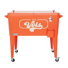 an orange ice chest sitting on top of a white table with the word's on it