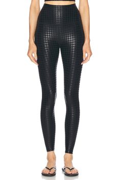 87% polyester 13% elastane.  Made in USA.  Machine wash.  High-waisted fit.  Logo detail at back.  Shiny coated fabric.  Item not sold as a set.  .  .  .  .  .  .  .  .  . Luxury Body Wash, Cut Out Leggings, Fit Logo, Shiny Leggings, Black Houndstooth, Yoga Is, Athleisure Wear, Beyond Yoga, Fine Fabric