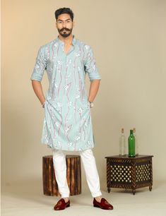 This is a bespoke product, specially crafted for you. This Attire is Highlighted with Buttons. Crafted in Chinese Collar and Full Sleeves Available with a Cotton Lycra Pajama in White Do note: Footwear shown in the image are also made to order and can be added separately, but it takes 15 days processing time. (Slight variation in actual color vs. image is possible) Floral Print Top For Eid, Festive Summer Kurta With Digital Print, Festive Traditional Tops With Digital Print, Cotton Traditional Wear With Floral Print For Wedding, Wedding Cotton Sets With Block Print, Cotton Block Print Wedding Sets, Wedding Cotton Block Print Sets, Printed Cotton Traditional Wear For Diwali, Cotton Kurta With Block Print For Wedding