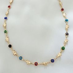 Lightweight delicate multi color Evil eye necklace with elephant design and clasp closure. 14k triple gold plated Chain length: 18” Elephant diameter: 6.3mm Evil eye diameter: 6.6mm Hypoallergenic Water resistant & tarnish free Nickel & lead free Colorful Evil Eye Necklace, Multicolor Spiritual Jewelry With Evil Eye, Evil Eye Necklace Rainbow, Multicolor Evil Eye Spiritual Jewelry, Multicolor Spiritual Evil Eye Necklace, Elephant Design, Sustainable Jewelry, Evil Eye Necklace, Eye Necklace