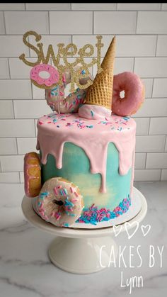 a cake decorated with donuts and ice cream