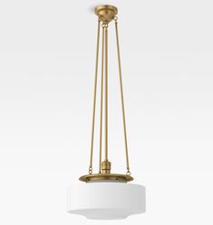 a white and gold light fixture hanging from the ceiling