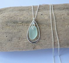 Beautiful aqua sea glass sterling silver teardrop necklace. This lovely piece of sea glass was collected by me at the famous Seaham beach. It is top drilled and fitted with sterling silver bail to an 18 inch sterling silver chain. The sea gIass is framed by a sterling silver teardrop which measures 29mm high x 17mm widest. Please let me know if you would like a different chain length - I'd be happy to arrange it at no extra cost. Each piece of sea glass I use in my jewellery is beautifully frosted and carefully selected for the design based on colour, size and shape. They are shaped and frosted by the sea and time only. I pour my heart into the jewellery I make and I hope you will treasure it as much as I treasure creating it. This necklace is packaged in a white organza bag and tissue pap Silver Teardrop Sea Glass Jewelry, Teardrop Sea Glass For Jewelry Making, Seaham Beach, Sea Glass Gifts, Glass Jewellery, Sea Glass Necklace, Teardrop Necklace, Glass Gifts, Sea Glass Jewelry