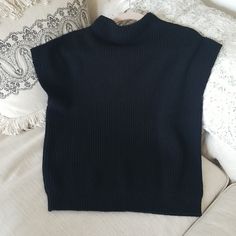 Brand New, Kenneth Cole Mock Neck Sleeveless Sweater. Longer Length, I'm 5' 7" And It Hits The Top Of My Thighs. It's An Oversized Small, So Would Probably Fit Up To A Small Large. I'm Listing As A Medium. Excellent Designer Quality Black Turtleneck Knit Sweater Vest, Black Knit Vest For Workwear, Black Turtleneck Sweater Vest For Layering, Black Knit Vest For Work, Black Turtleneck Sweater Vest For Fall, Black Stretch Turtleneck Sweater Vest, Sleeveless Black Sweater For Work, Casual Black Turtleneck Sweater Vest, Black Fitted Sleeveless Sweater