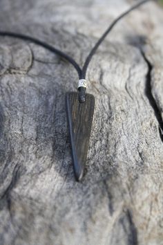 With a beautiful glossy finish, this unique Irish Bog Oak pendant is a one-off piece. Bog-wood comes from ancient forests that once covered Ireland. Huge oaks and yew trees have been buried in peat bogs and preserved from decay by the acidic and anaerobic bog conditions, sometimes for hundreds or even thousands of years. The wood is usually stained by tannin dissolved in the acidic water (black for the oak and a lovely brown for the yew). Bog-wood represents the early stages in the fossilization Unique Black Necklace For Gift, Unique Black Necklaces For Gifts, Artisan Black Engraved Necklace, Black Artisan Engraved Jewelry, Artisan Black Jewelry Gift, Artisan Black Jewelry For Gift, Peat Bog, Old Irish, Ancient Forest