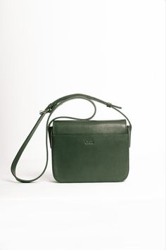 Smooth leather crossbody bag, lined with cotton fabric. It features a front flap with magnetic snap closure it has a roomy compartment, a slim interior pocket, and one exterior pocket.The strap is adjustable. Leather Dye, Nice Leather, Vegetable Tanned Leather, Green And Brown, Smooth Leather, Tan Leather, Leather Crossbody Bag, Snap Closure, Leather Crossbody