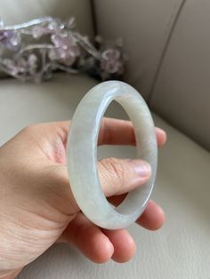 "🌈 Jade Bangle 57.3mm (2.25\"), Round Shape, Light Green 🌷 Untreated Natural Jadeite/ Grade A Jade/ Certified 🌷 Jade from Myanmar/ Burma 🌷 100% handmade carving 🌷 Inner diameter : 57.3mm / 2.25\" 🌷 Shape : Round 🌷 Color : Light Green 🌷 Free standard shipping from Hong Kong with tracking included 🌷 Take approximately 7-21 days to arrive worldwide ❤️ In Chinese Culture: Young people wear jade pendant will have a prosperous life, attracts good luck and friendship Old people wear jade penda White Gemstone Bangle For Gift, Elegant Jade Round Bangle, Luxury White Jade Jewelry, White Gemstone Round Bracelets, Lavender Green, Jade Bangle, Gemstones Jewelry, Good Marriage, Jade Pendant