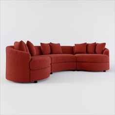 a red sectional couch with pillows on the top and bottom corner, in front of a white background