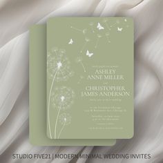 a wedding card with a dandelion and butterflies on it, in light green