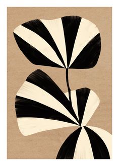 two black and white leaves on a brown background with the same pattern as one leaf