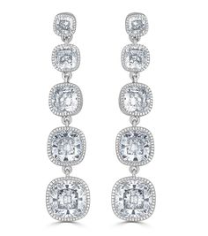 Lucille Long Drop Earrings - Rhodium Plated Sterling Silver / 9 Cubic Zirconia / Post with Friction BackFour graduated cushion-cut Cubic Zirconia in beautiful linear drop make quite the statement earrings. Each stone is framed by a milgrain bezel setting, which creates quite a scintillating effect as the diamond alternative premium cut cubic zirconia flaunt their radiance. The brilliant sparkle of the CZs is the perfect amount of glamour for this more relaxed and casual pair of drop earrings. To create a formal red carpet worthy look , wear these earrings with the Lucille Riveria Necklace or layered Lucille Bracelets.Rhodium Plated 925 Sterling Silver, Gold and Rose GoldAvailable in 18Kt Yellow Gold PlatedHandset Cushion Cut Diamond Like Flawless CZ Premium Quality Grade 5A Cubic Zirconia Headpiece Jewelry, Diamond Alternatives, Bridal Engagement Rings, Bride Accessories, Long Drop Earrings, Cushion Cut Diamonds, Cubic Zirconia Earrings, Travel Jewelry, Silver Drop Earrings