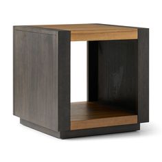 a small wooden table with an open shelf on one side and a closed drawer on the other